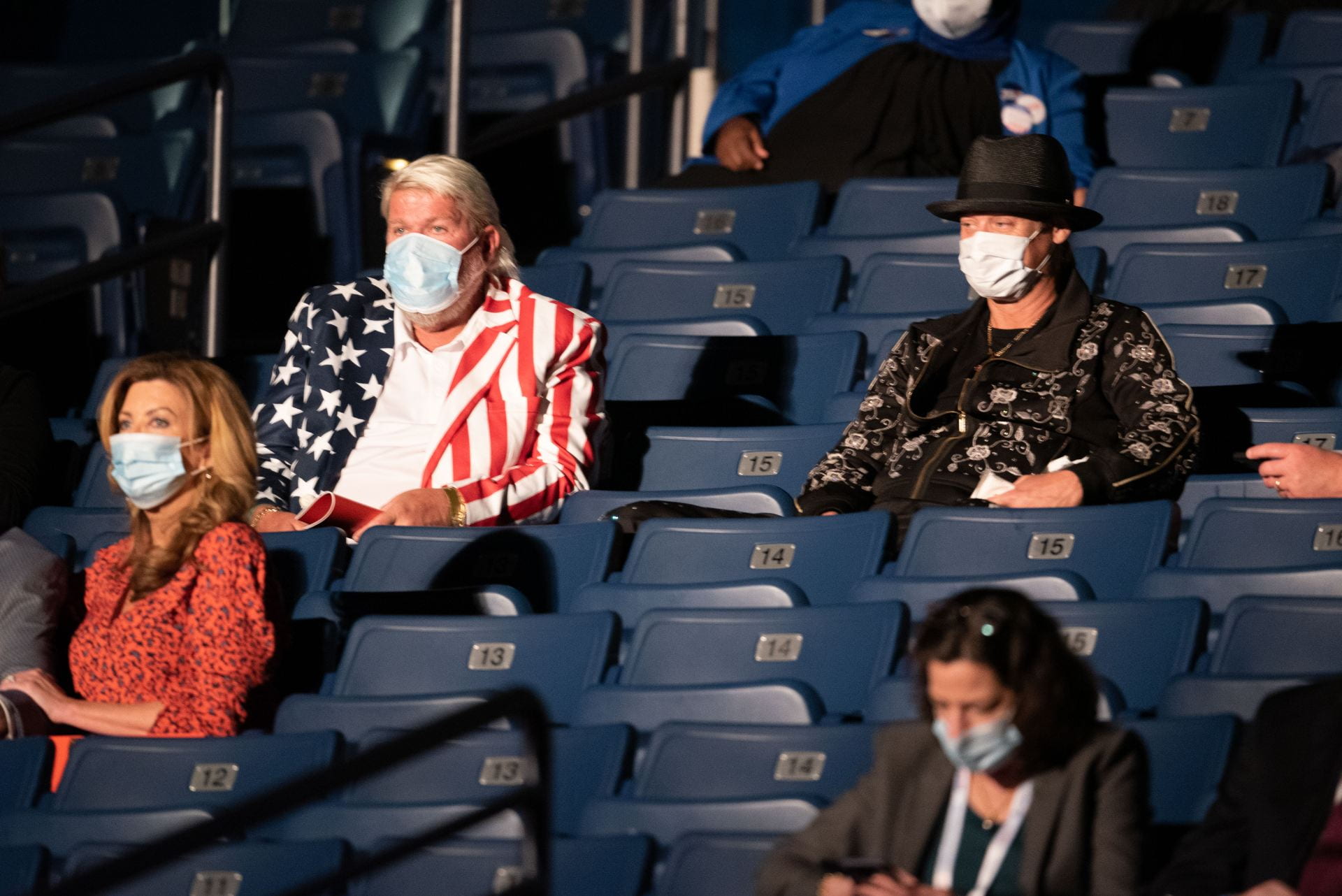 John Daly and Kid Rock talk in the stands before debate