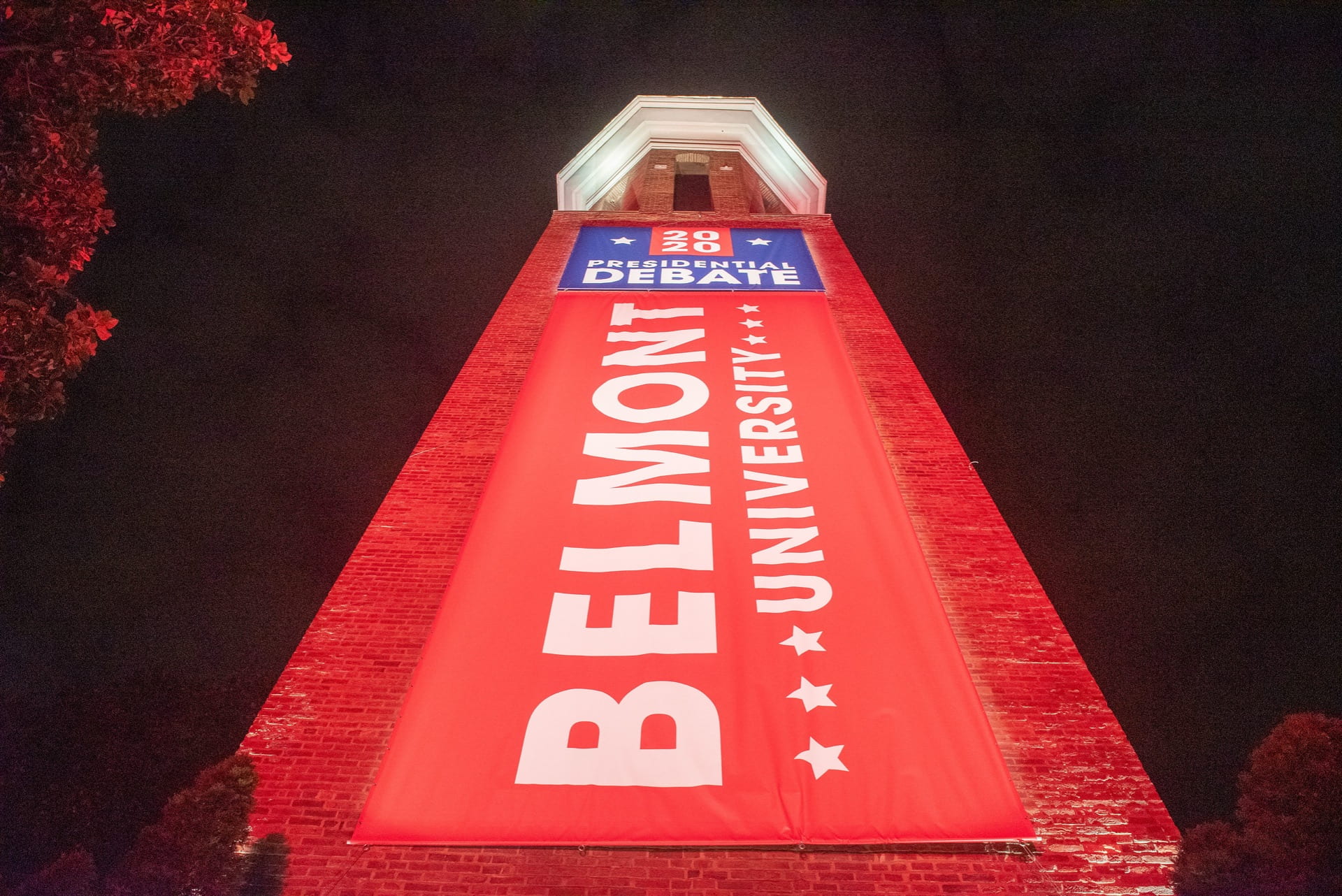 Belmont 2020 Debate Banner on the bell-tower at night