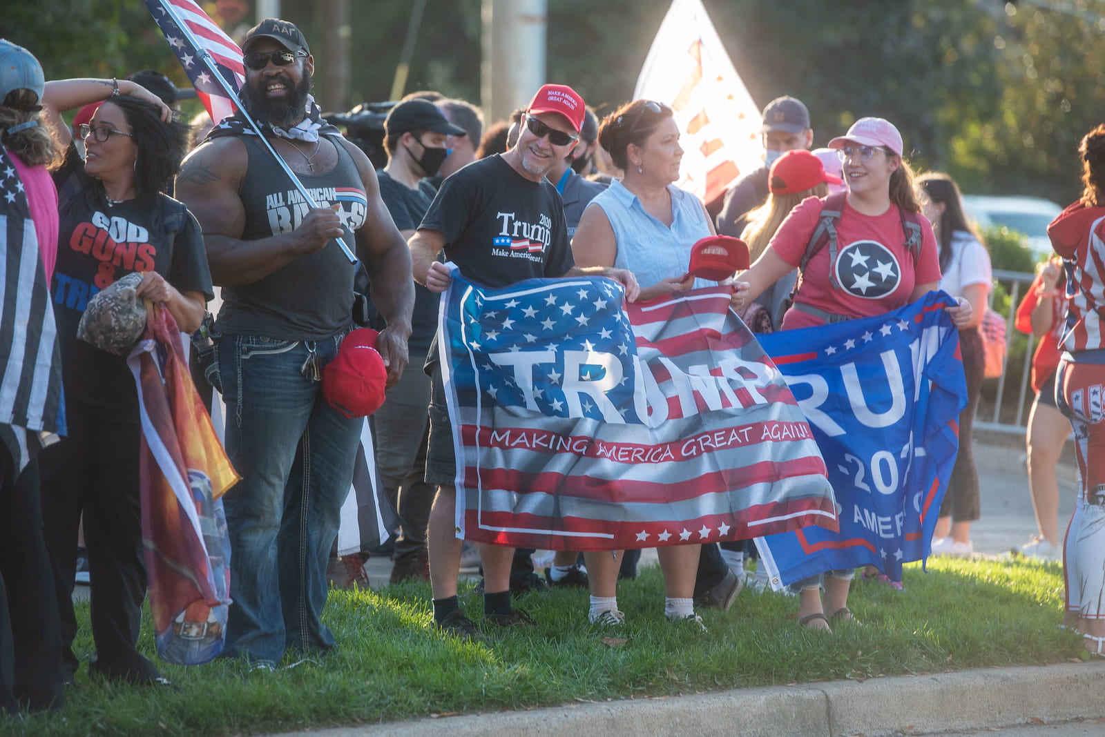 Trump supporters holding Trump supporting flags outside of Belmont University on day of debate